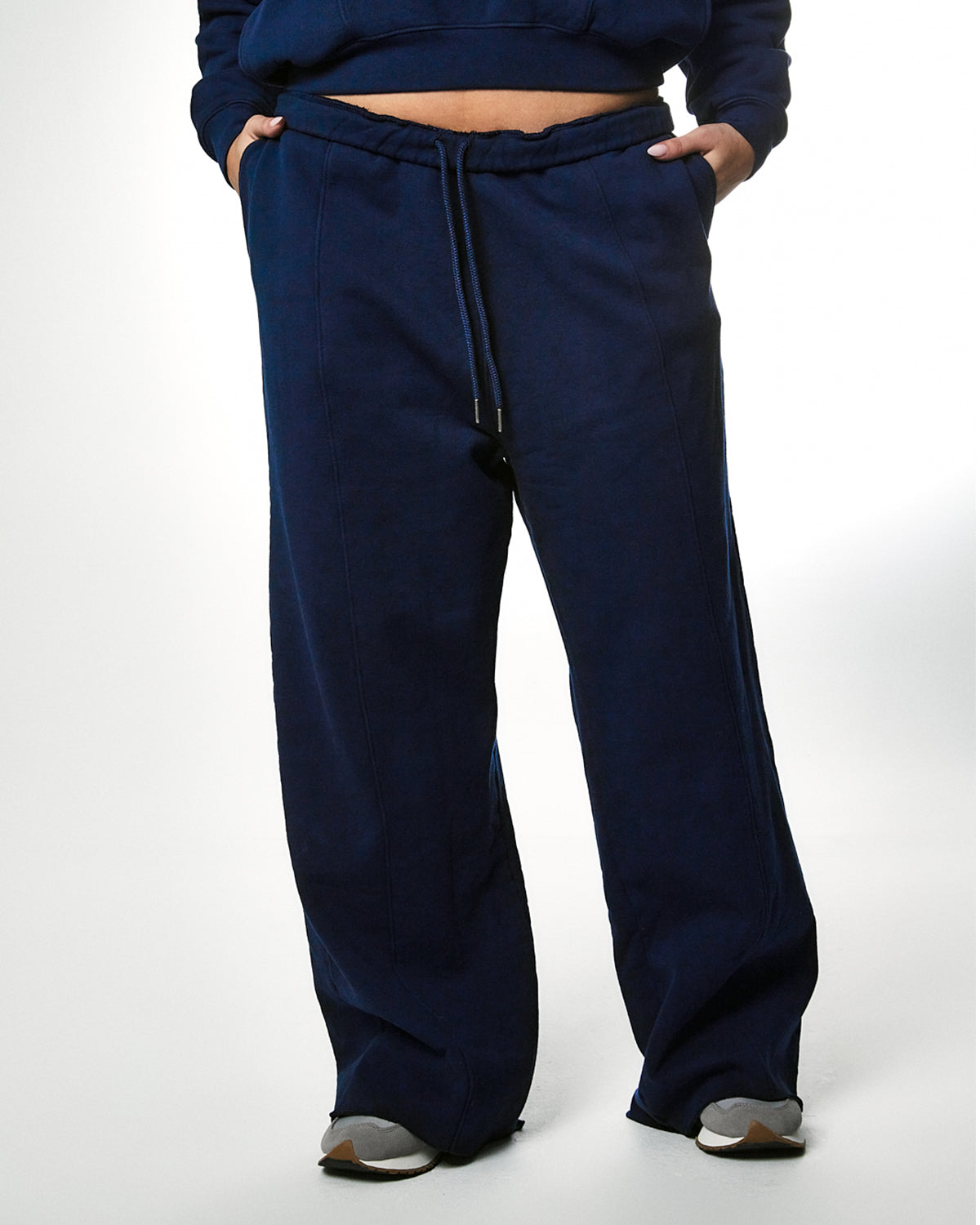 
                  
                    navy blue fleece cotton straight leg drawstring sweatpants raw hem
                  
                