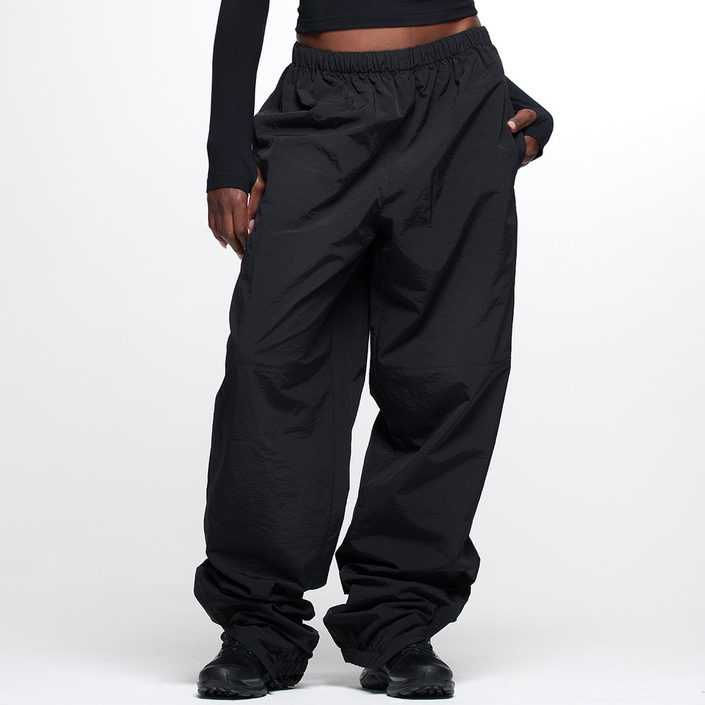 black nylon cargo style track pants elastic waist zip cuffs
