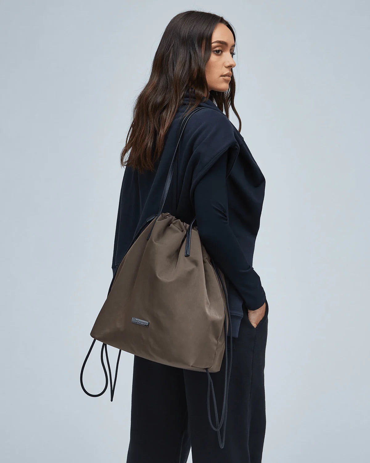 A brown nylon shoulder bag