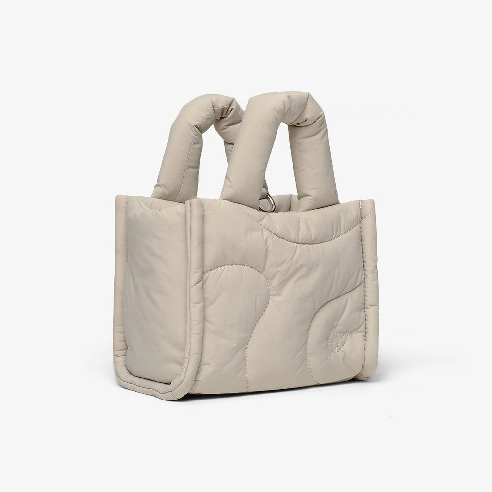 A small puffer bag in beige