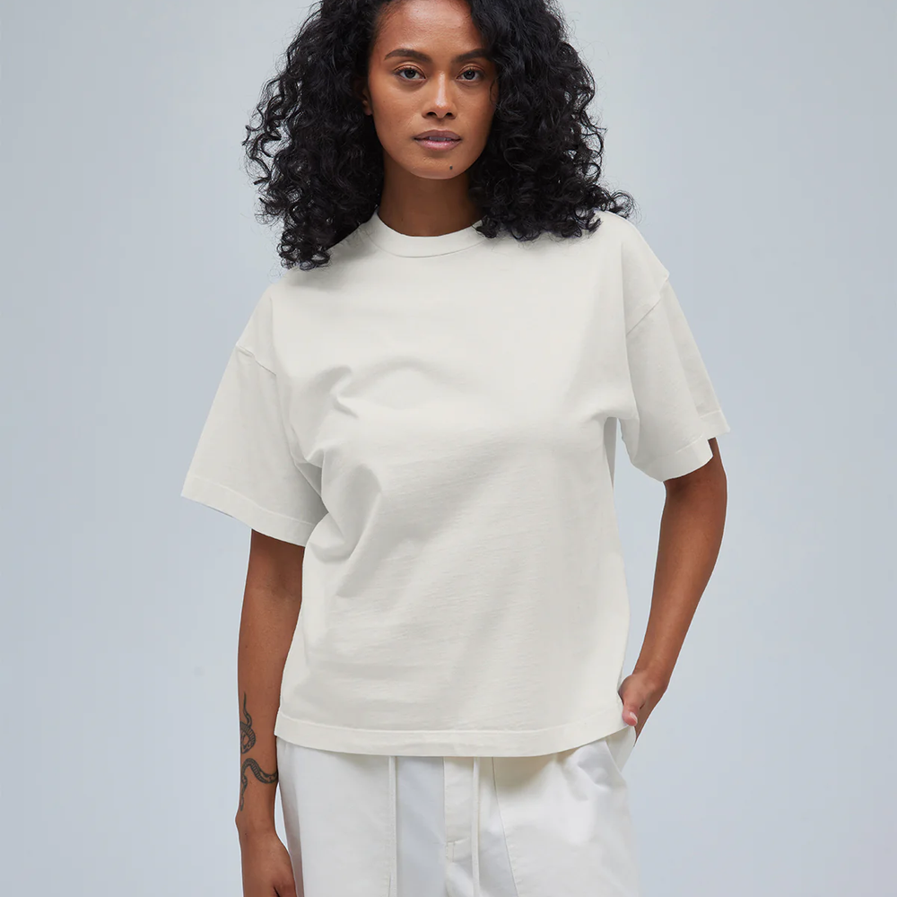 A model wearing women's boxy tee and pants in cream